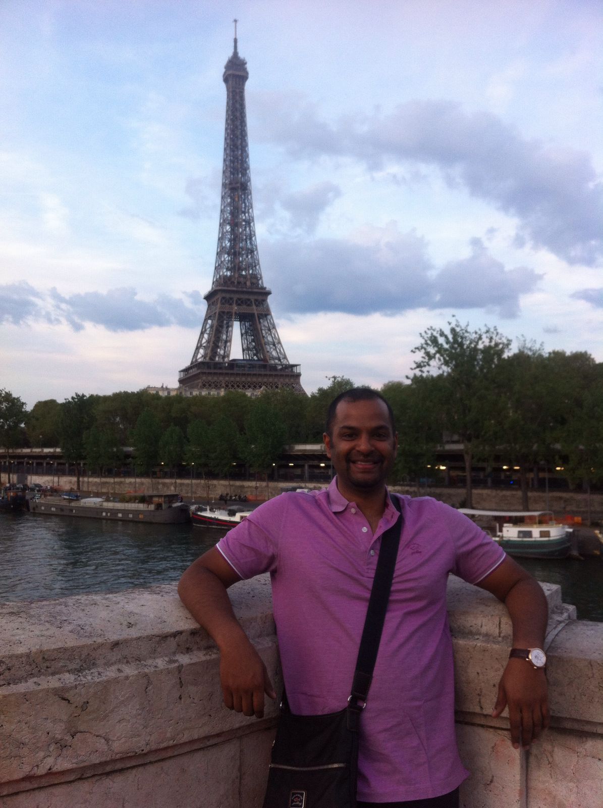 Jonathan in front of the Eiffel Tower---www.thethreeyearexperiment.com
